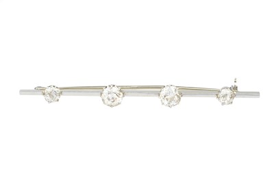 Lot 124 - A diamond four stone bar brooch, the uniform...