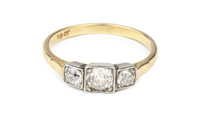 Lot 123 - A diamond three stone ring, the graduated...