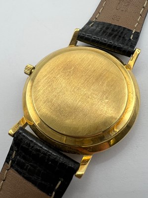 Lot 213 - An 18ct gold automatic wristwatch by...