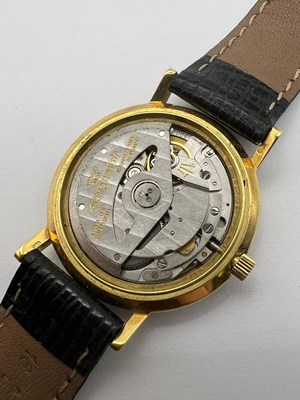 Lot 213 - An 18ct gold automatic wristwatch by...