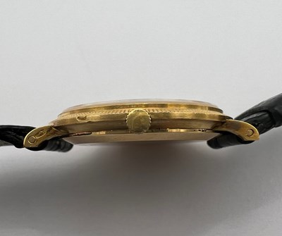 Lot 212 - A wristwatch by Piaget, the circular green...