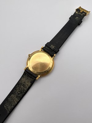 Lot 212 - A wristwatch by Piaget, the circular green...