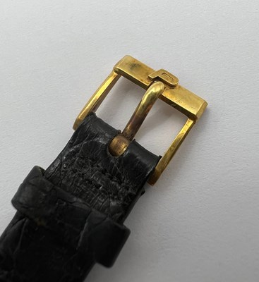 Lot 212 - A wristwatch by Piaget, the circular green...