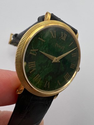 Lot 212 - A wristwatch by Piaget, the circular green...