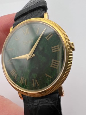 Lot 212 - A wristwatch by Piaget, the circular green...