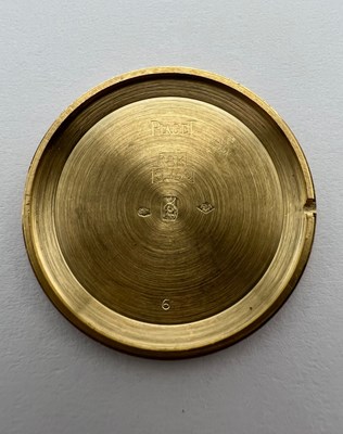 Lot 212 - A wristwatch by Piaget, the circular green...