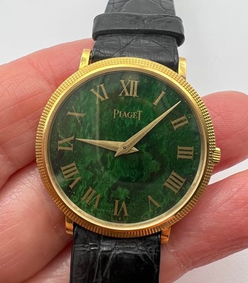 Lot 212 - A wristwatch by Piaget, the circular green...