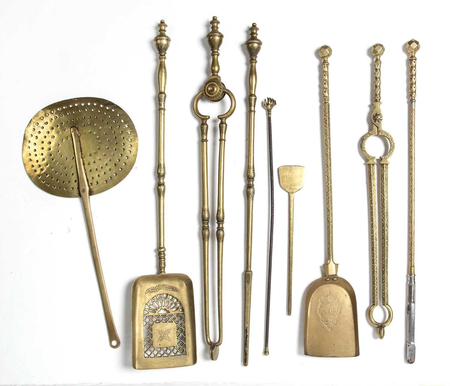 Lot 109 A set of three brass fire irons, a