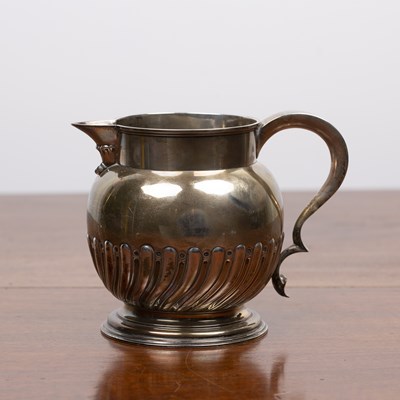 Lot 216 - Victorian silver jug with trophy handle on...