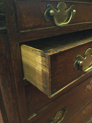 Lot 60 - An 18th century oak chest of five long...
