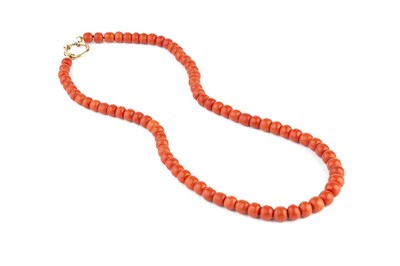 Lot 113 - A coral bead necklace, the single strand of...