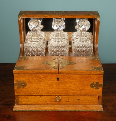 Lot 280 - An antique combined tantalus and cigar box,...