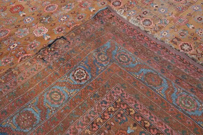 Lot 1040 - A Persian light brown ground carpet