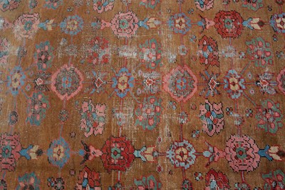 Lot 1040 - A Persian light brown ground carpet