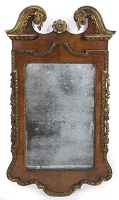 Lot 155 - A George II walnut and parcel gilt wall mirror...