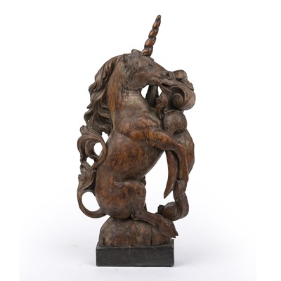 Lot 152 - A late 18th/19th century carved elm Unicorn,...