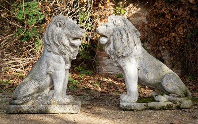 Lot 1121 - A pair of large cast reconstituted stone seated lions