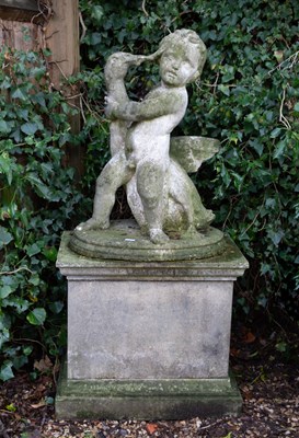 Lot 1194 - A sculpture of a putti and a goose