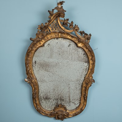 Lot 123 - A Rococco style gilt framed wall mirror,...