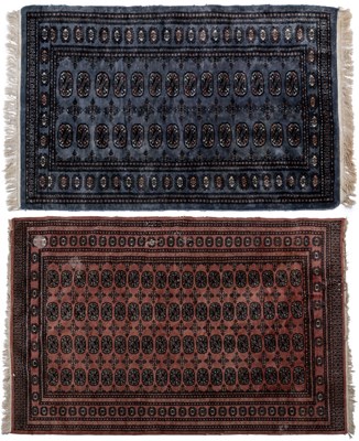 Lot 1068 - An old pink ground Baluchi style Oriental rug; together with a grey-blue ground Baluchi style rug