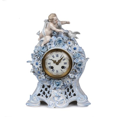 Lot 4 - A 19th century French porcelain mantel clock...