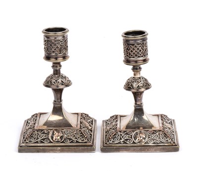 Lot 117 - A pair of antique silver plated candlesticks...