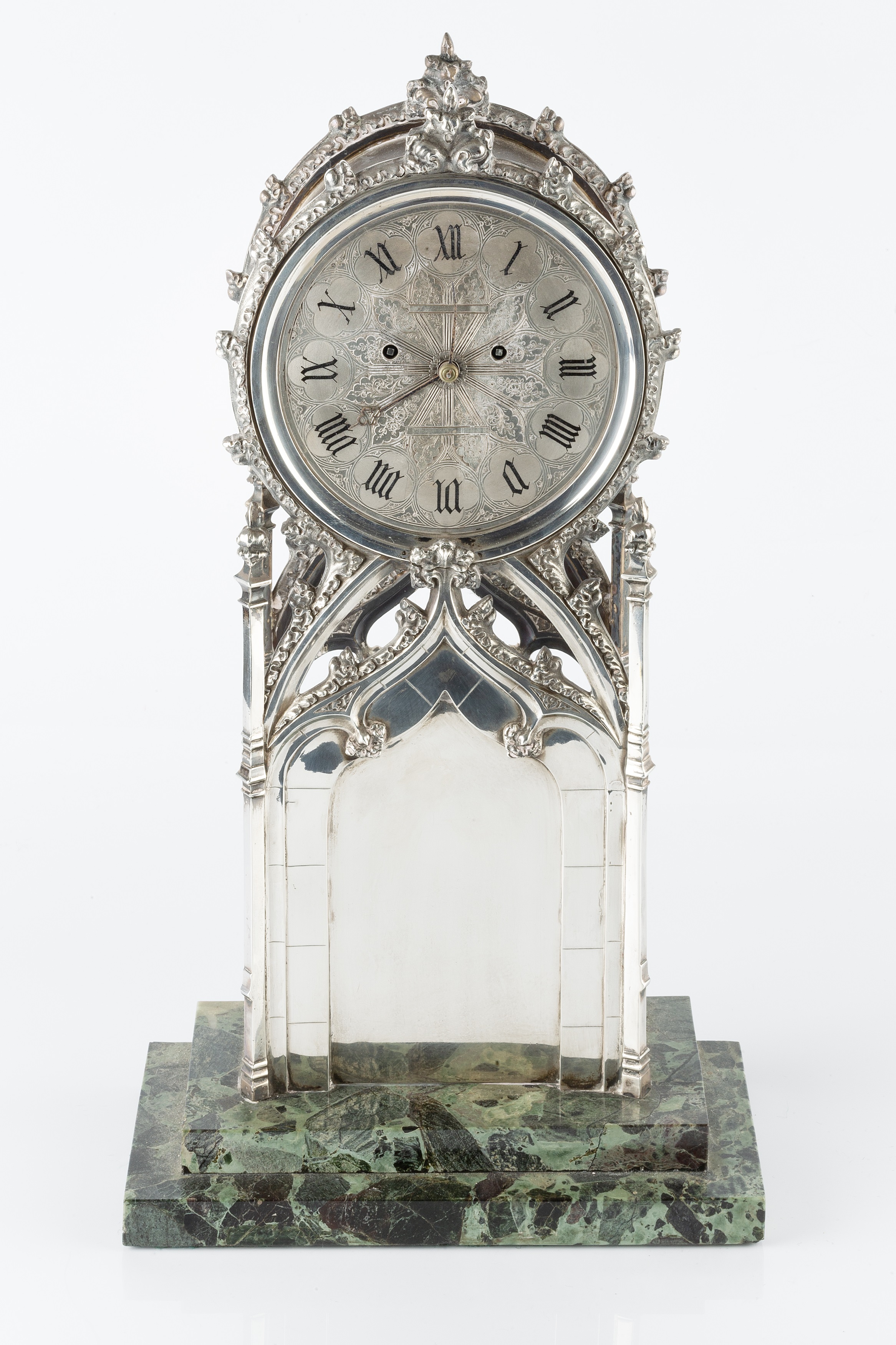 Lot 583 An early Victorian silver mantel clock, the