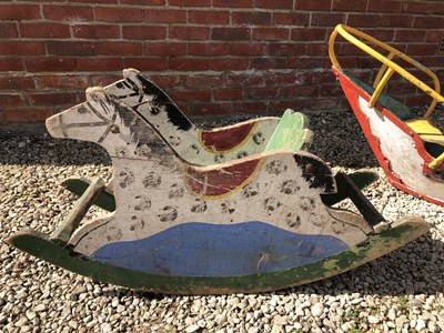 Lot 311 - A vintage painted wood rocking horse and a vintage painted metal rocking boat
