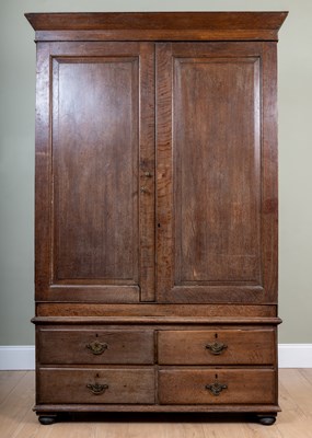 Lot 198 - A 19th century oak linen press, the panelled...