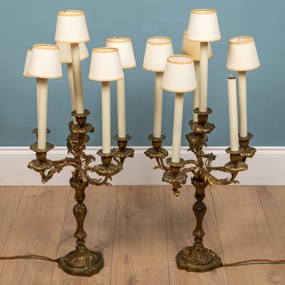 Lot 345 - A pair of Rococo style continental gilt metal candelabra style lamp holders