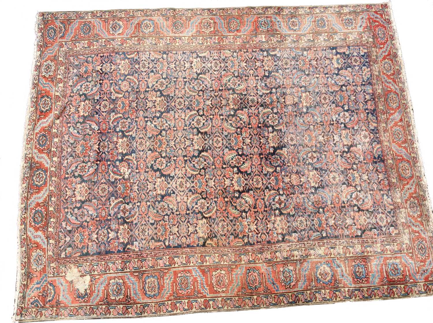 Lot 1047 - A large Persian rug