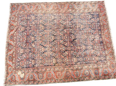 Lot 1047 - A large Persian rug