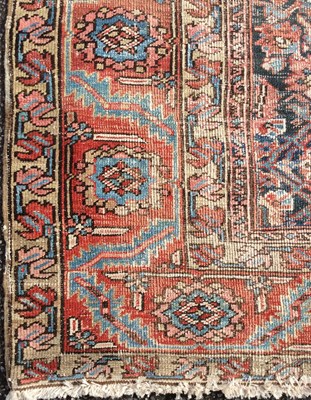 Lot 1047 - A large Persian rug