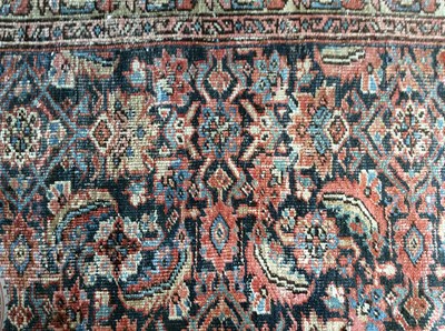 Lot 1047 - A large Persian rug