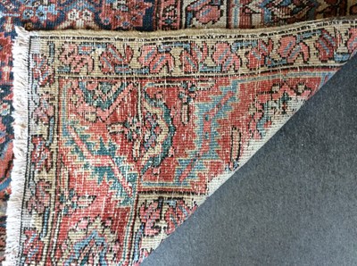 Lot 1047 - A large Persian rug