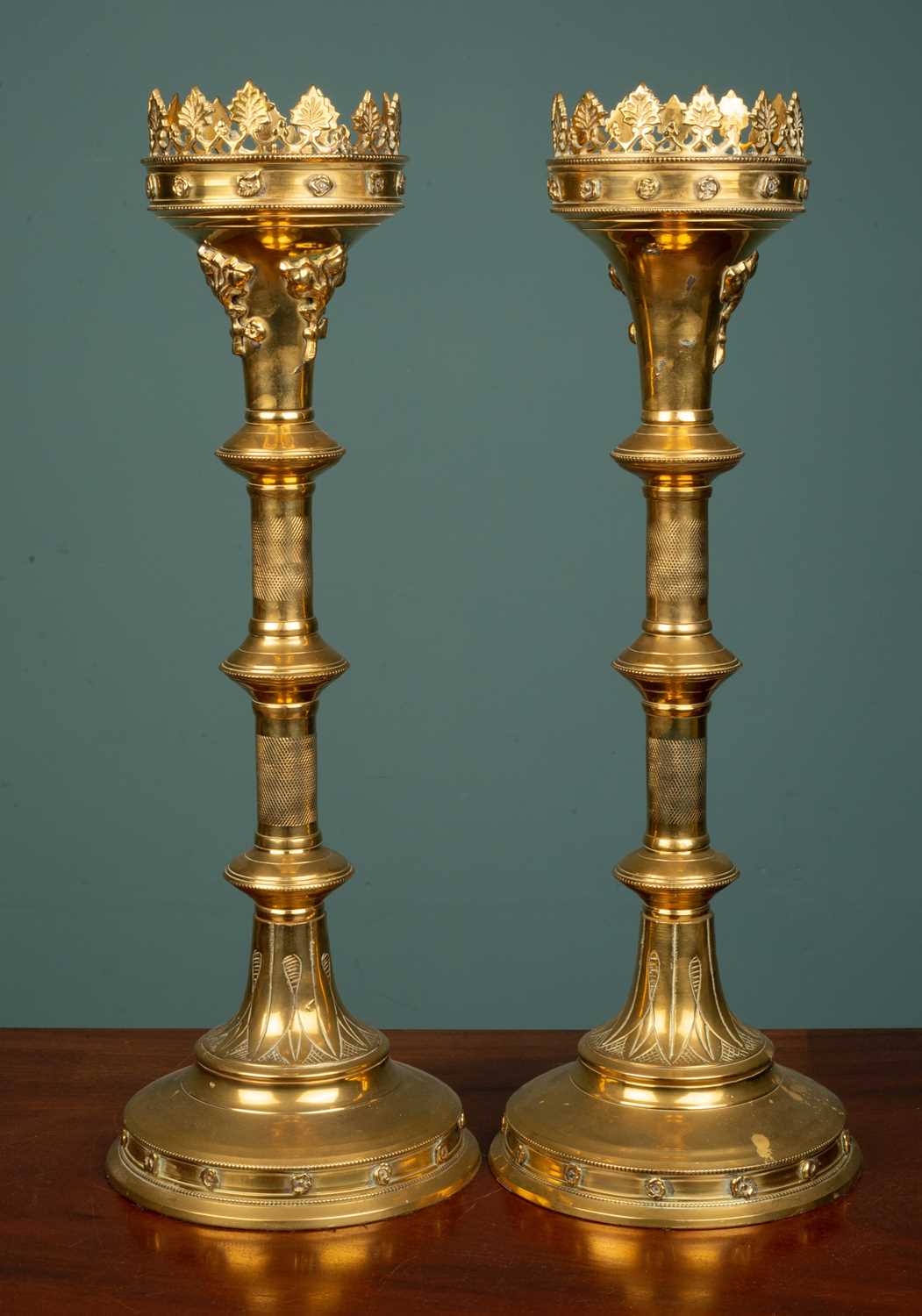 Lot 19 - A pair of Gothic-style brass pricket candlesticks