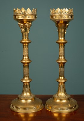 Lot 8 - A pair of Gothic style brass pricket candlesticks