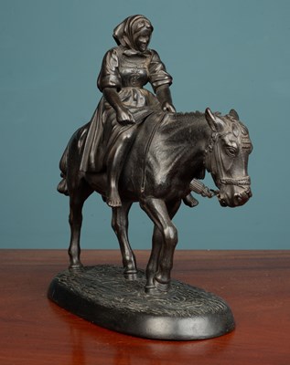 Lot 16 - A Russian cast iron sculpture of a figure on the back of a mule