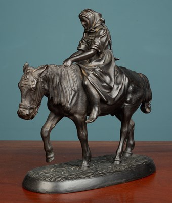 Lot 16 - A Russian cast iron sculpture of a figure on the back of a mule