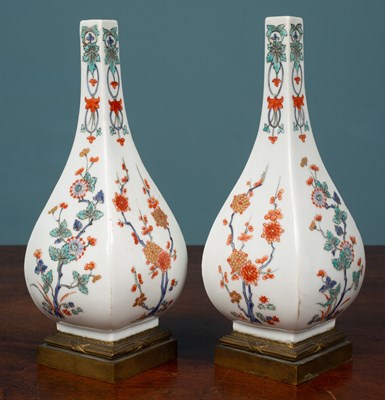 Lot 33 - A pair of French porcelain bottle vases