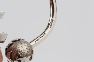 Lot 151 - A silver keyring by Tiffany & Co, in the form...