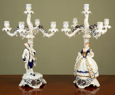 Lot 215 - A pair of four-branch German porcelain...