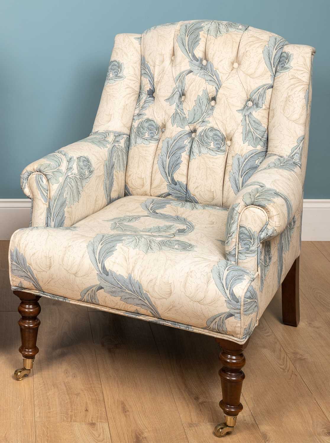 Lot 178 - A blue and white floral upholstered armchair...