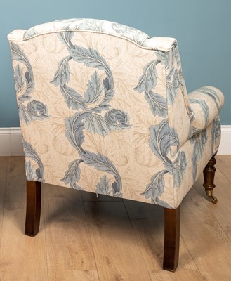 Lot 178 - A blue and white floral upholstered armchair...