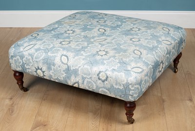 Lot 130 - A blue florally upholstered footstool