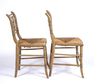 Lot 83 - A pair of Regency style faux bamboo painted...