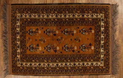 Lot 119 - Afghan gold ground rug with traditional...