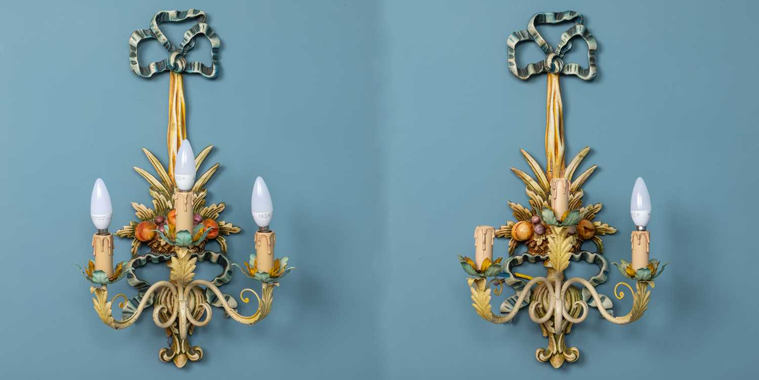 Lot 108 - A pair of modern painted carved wooden toleware three-branch wall lights