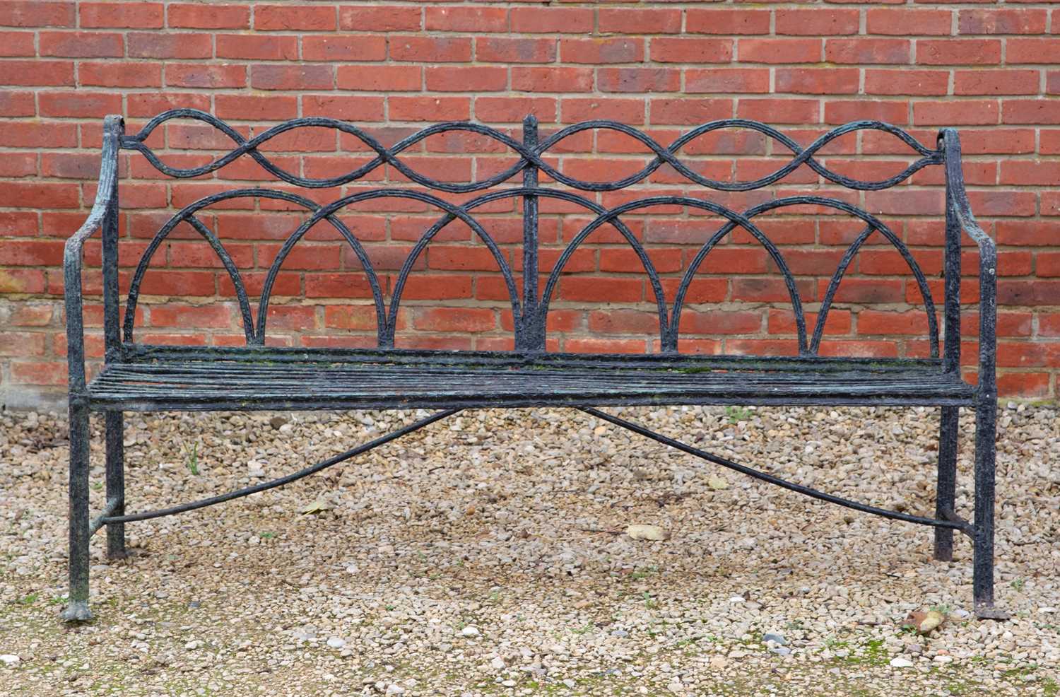 Lot 1159 - A Regency black painted wrought iron garden bench garden bench or seat