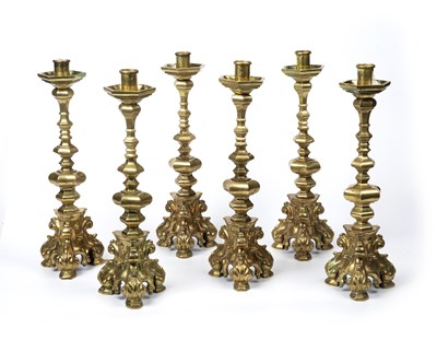 Lot 89 - A set of six heavy gilt metal candlesticks...